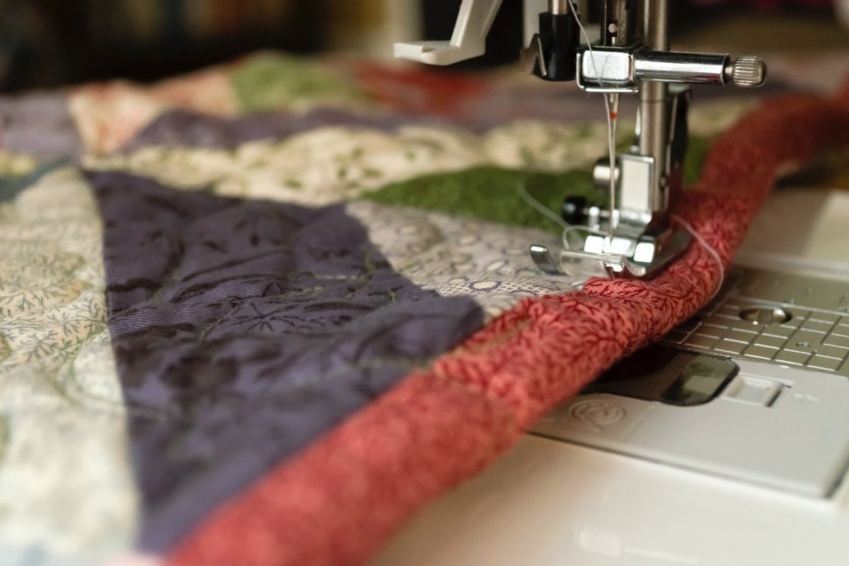 How does a sewing machine work?