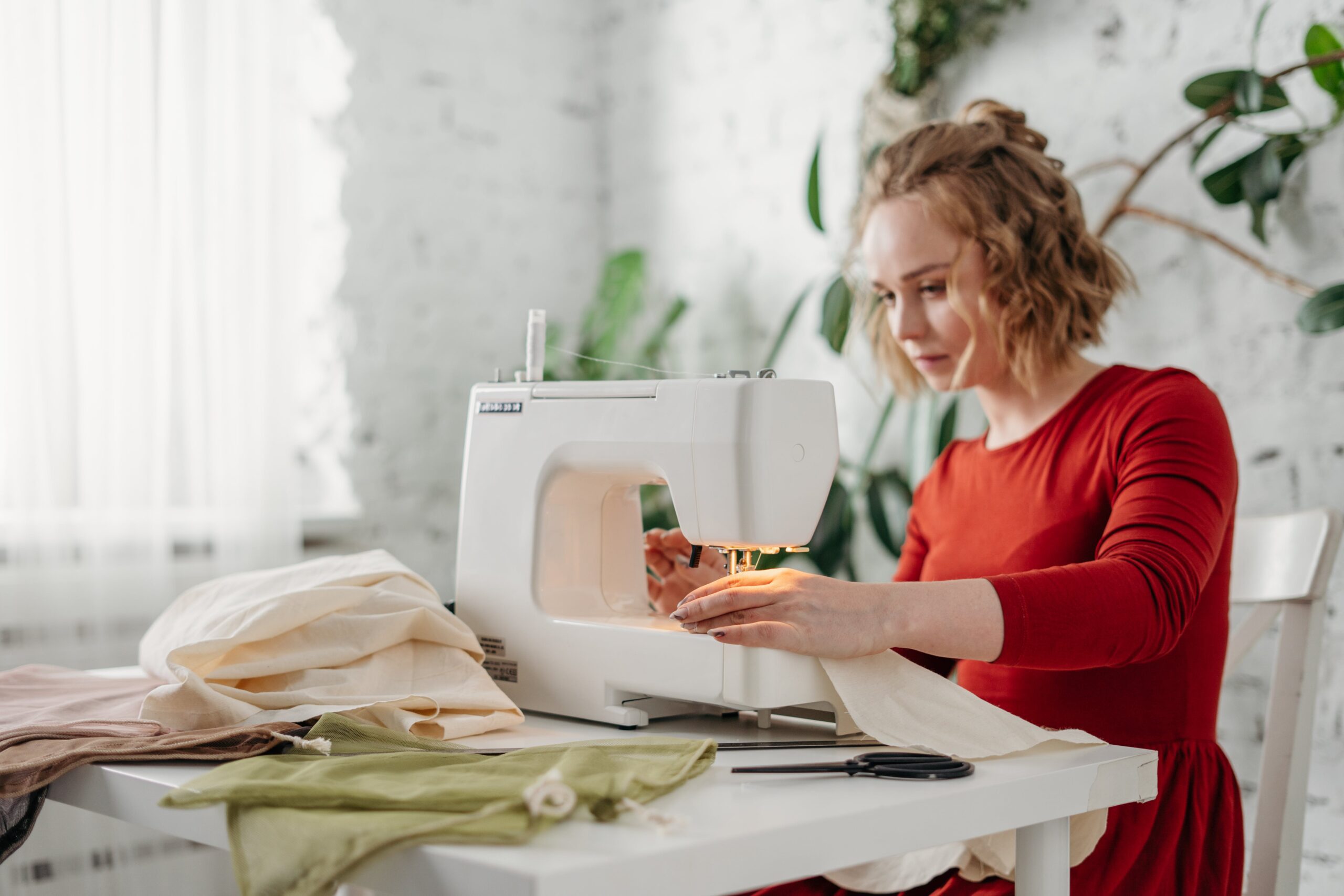 pexels-cottonbro-studio-3738088 Woman Sewing While Sitting on Chair