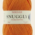 Ball of Sirdar Snuggly DK yarn in marmalade color