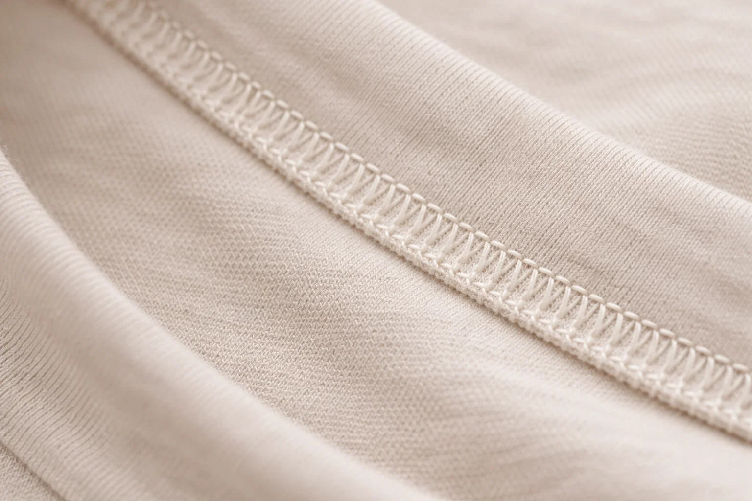 Inside seam of retail garment showing overlocked edge